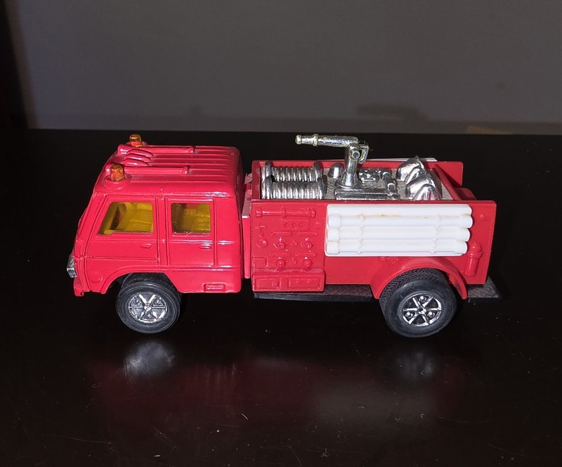 Fire engine with diecast cab and plastic body