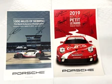 TWO PORSCHE RACING POSTERS,HAND SIGNED BY PORSCHE FACTORY DRIVERS, SEBRING,PETIT
