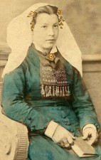 WOMAN IN TRADITIONAL DRESS HOLDING BOOK. CDV. 