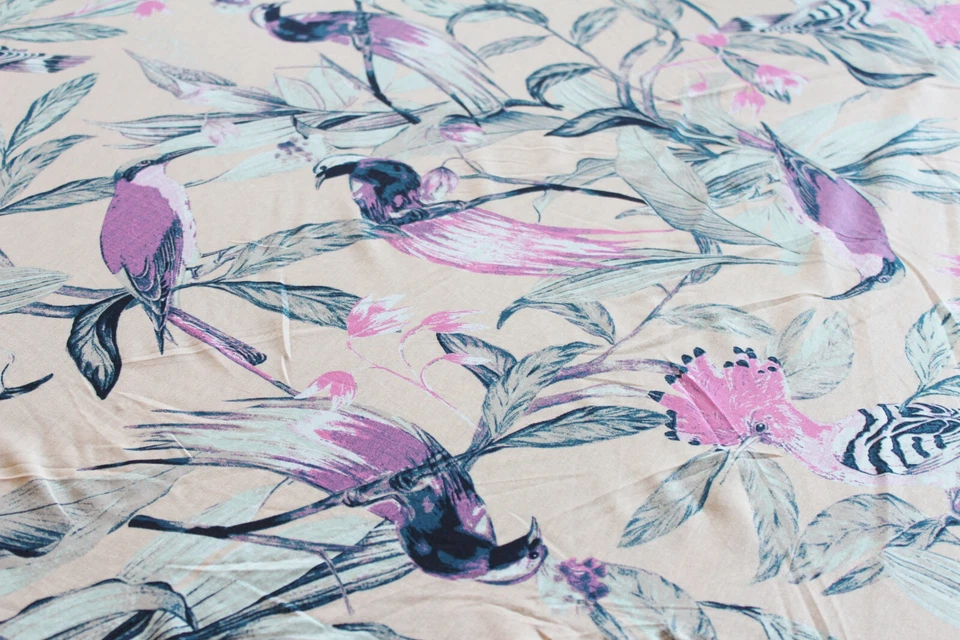 Jersey 4,20€/m² Interlock Modal "seltene Vögel" auf pastellorange MA12 - Bild 2 von 3