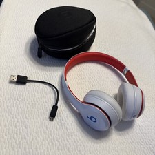 Beats Solo 3 Headphones on Ears White, Red, And Blue