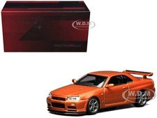 NISSAN SKYLINE GT-R R34 V-SPEC II RHD ORANGE 1/64 DIECAST BY MOTORHELIX M63471