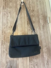 Pacsafe exomesh anti-theft bag crossbody blue purse fold over zip RFID
