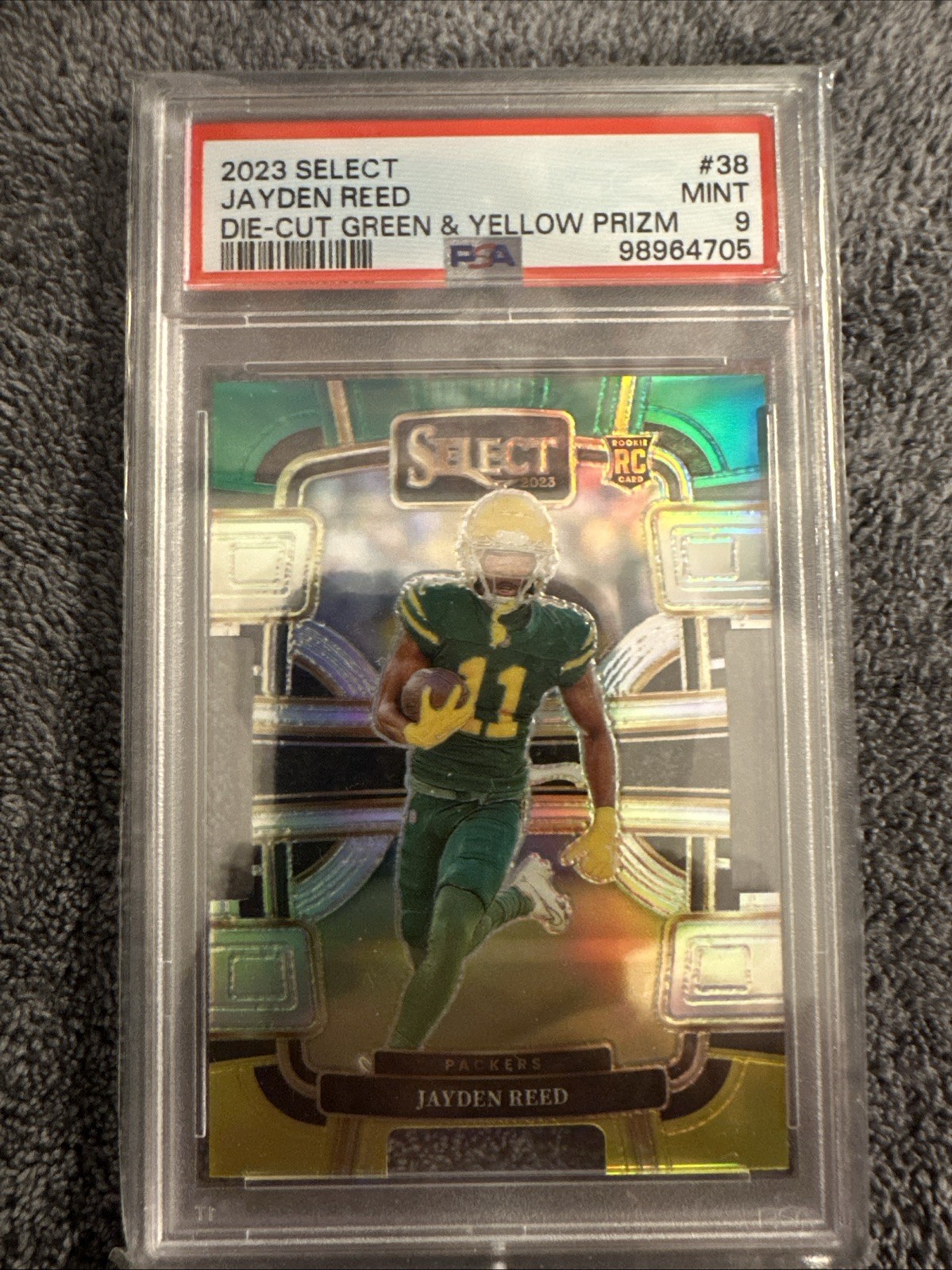 2023 Panini Select - Concourse Jayden Reed #38 Green & Yellow Die-Cut (RC) PSA 9