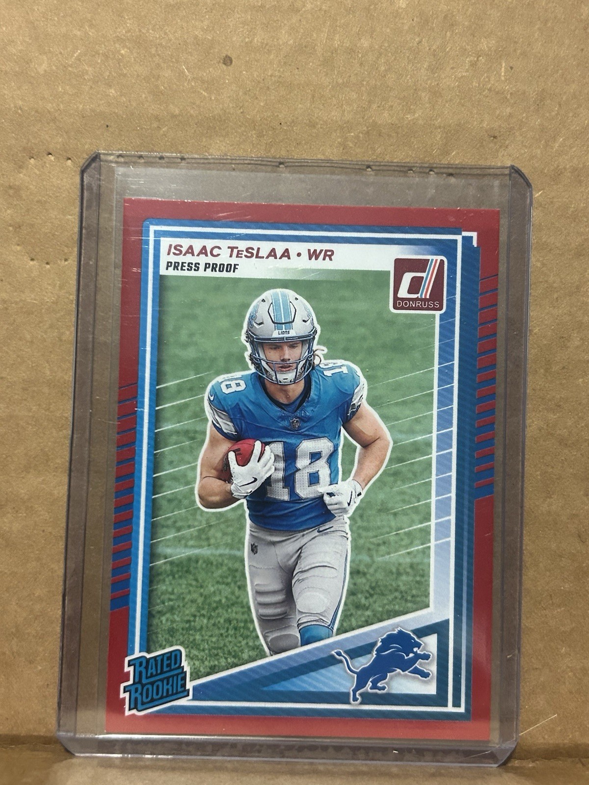 2025 Donruss Football Isaac TeSlaa Red Press Proof Rated Rookie Lions