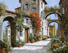 ceramic tile mural backsplash. Arch way garden passage in Tuscany Italy village