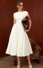 Luxurious White Cap-Sleeve Tea-LengthDress with Open Back