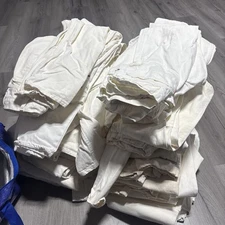 45 Pairs Of Vintage 1980s White Levi’s 550s. Sizes Range From 28-34 Waist.