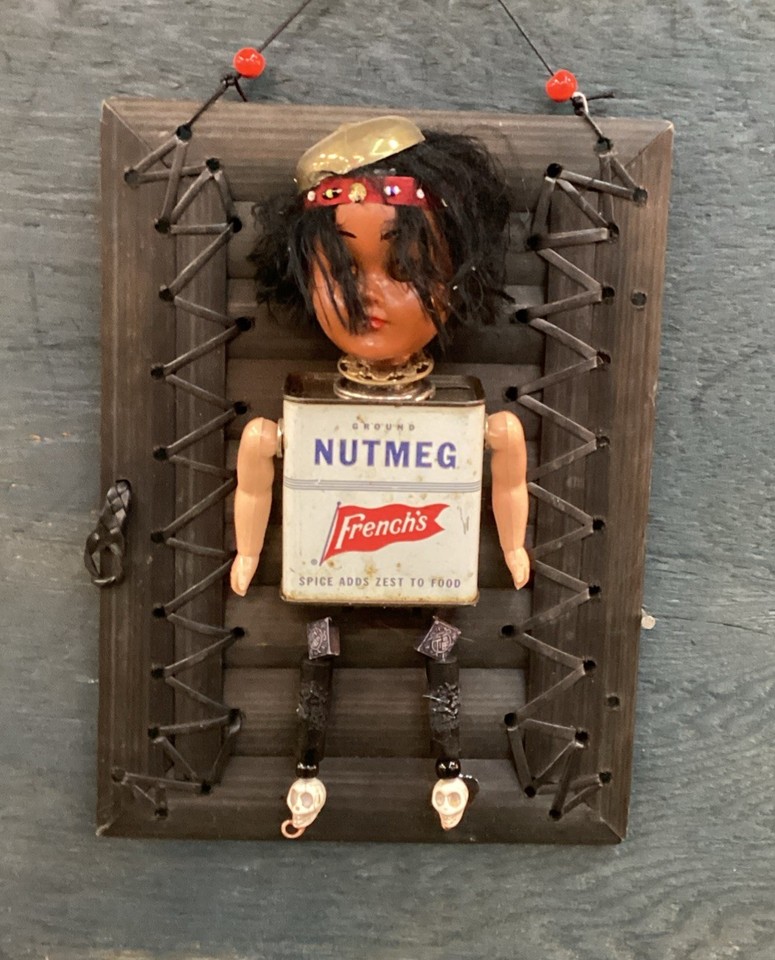 A one-of-a-kind assemblage wall piece built from vintage doll parts and found objects — the kind of unsettling, conversation-igniting art you can't find anywhere else.