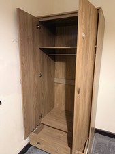 Modern compact wardrobe in beautiful natural wood finish, spacious bottom drawer