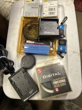 Lot of Vintage Nikon Parts and Accessories. Filters Chargers Batteries Caps