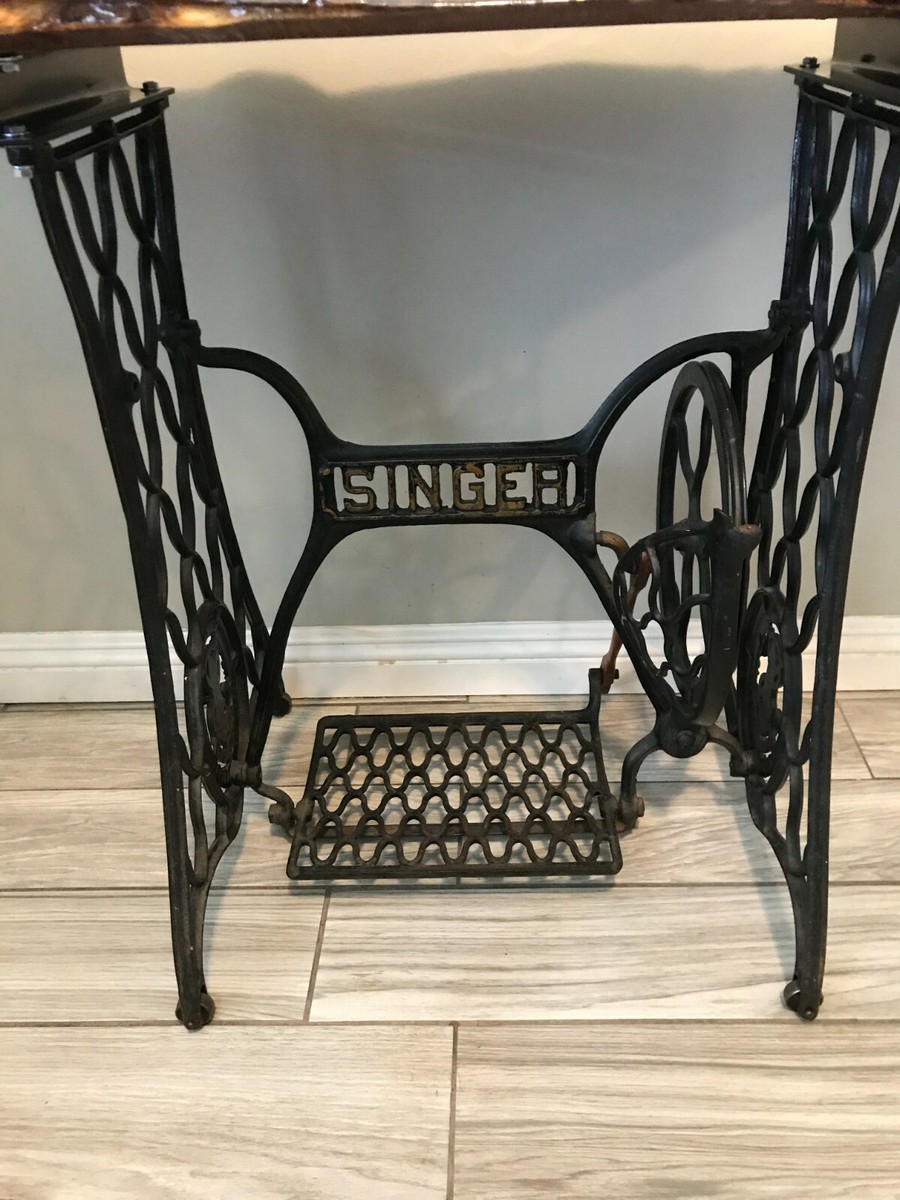 Live edge wood entry way table on vintage 1900s sewing machine