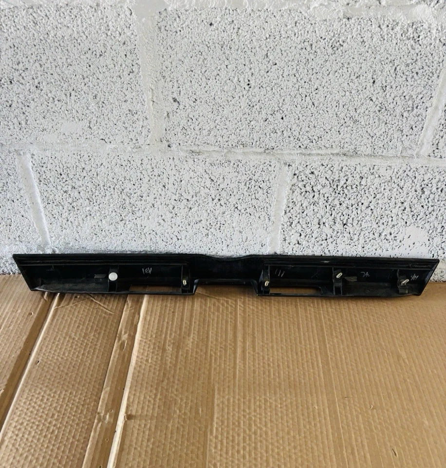 2004-2010 TOYOTA SIENNA LIFTGATE LICENSE PLATE MOLDING. P/N 76801-AE011. - Image 2 of 3