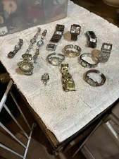 13 various watches and 2 Watch Faces. They range in brands of a Geneva NYNC...