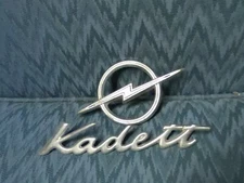 3 total pieces-vintage unrestored auto emblems. factory original items