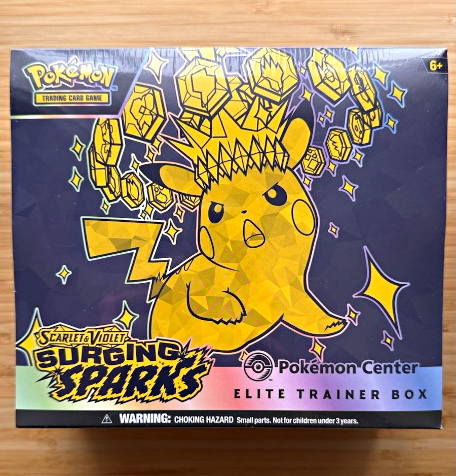 Surging Sparks Pokémon Centre Elite Trainer Box. Small tear - see photos.