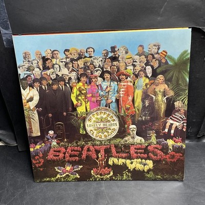 The Beatles Sgt. Peppers Lonely Hearts Club Band Vinyl Record with Cut-Outs