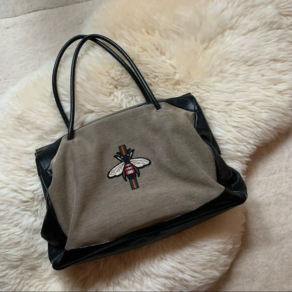 Leather-trimmed embroidered canvas tote