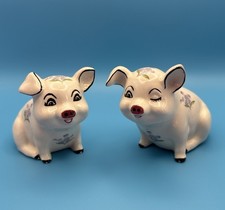 Pair Of Pig Figurines One Winking At You