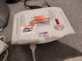 Console GX 4000 - Amstrad GX4000 2 manettes et 2 Jeux burning rubber Robocop 2