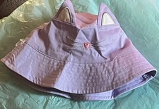 Little girls beach hat purple in color one size.