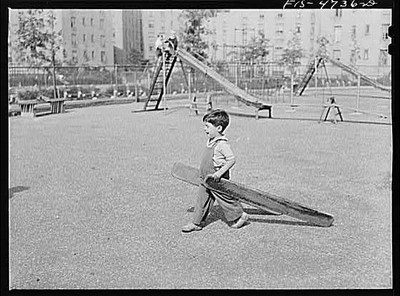 Queens, New York. Child playing with boards at the nursery school at the