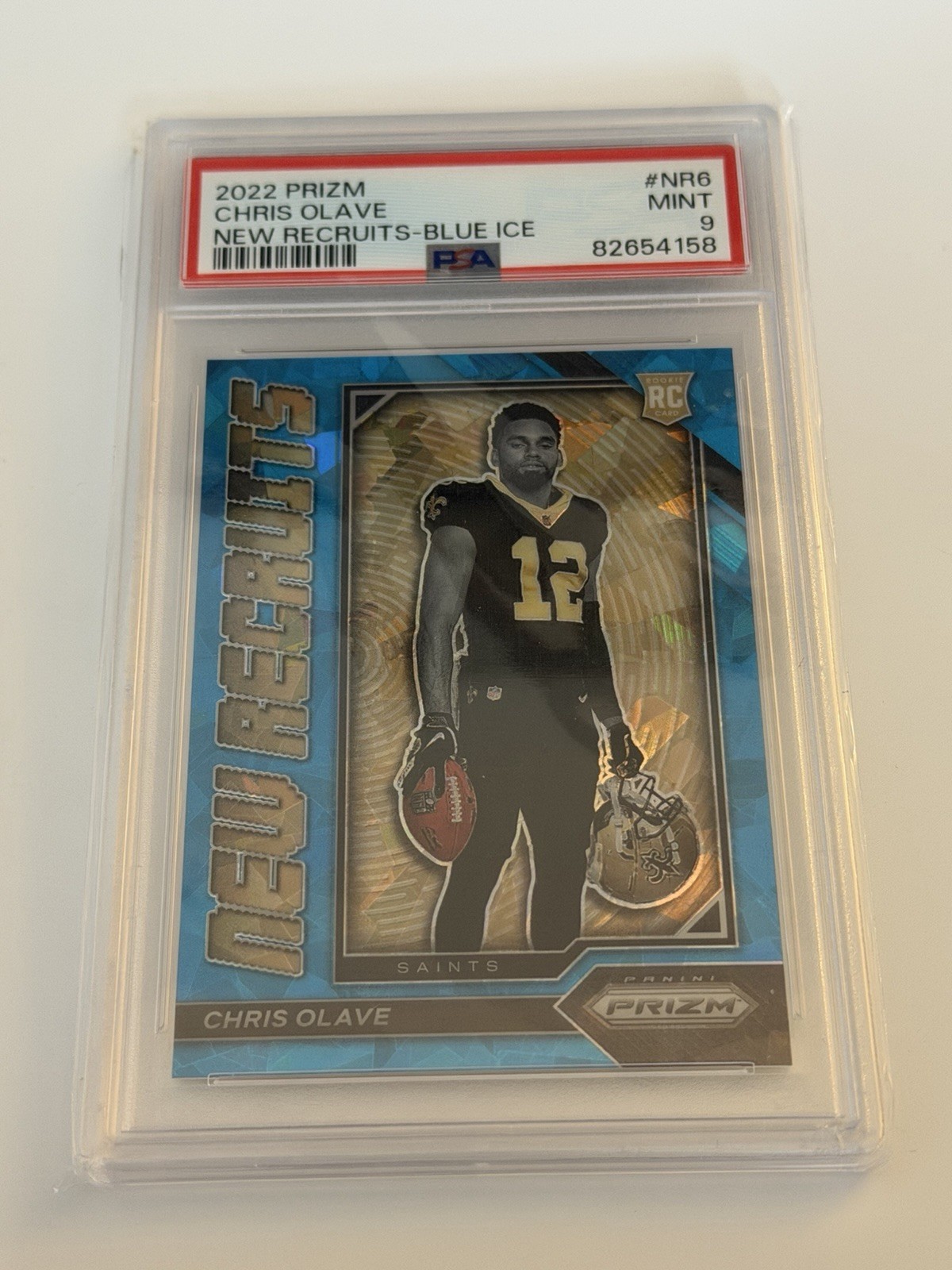 2022 Panini Prizm CHRIS OLAVE New Recruits - Blue Ice Rookie /99 Saints - PSA 9