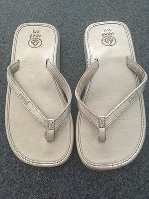 reef silver flip flops