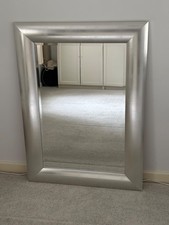 large silver framed mirror
