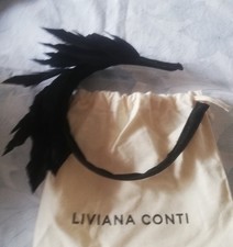 Headband with black feathers on its original Liviana Conti case 