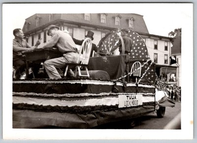 Vtg B&W Snapshot Parade Float Men USA Decorations 1950s