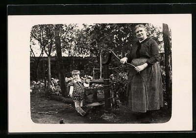 Photo Postcard Woman and Small Child at Water Pump in Garden 