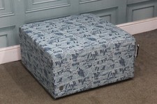 G PLAN, JAY BLADES FOOTSTOOL IN BLUE PATTERNED FABRIC. (1280)