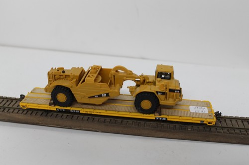 Coche plano escala HO Intermountain 46412-05 con carga CAT 627G OTTX 92139 MW Kadees | Zustand: Used