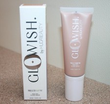 Base Huda Beauty GloWish Multidew Skin Tint 04 Ligera Mediana 1.35 Tamaño Completo