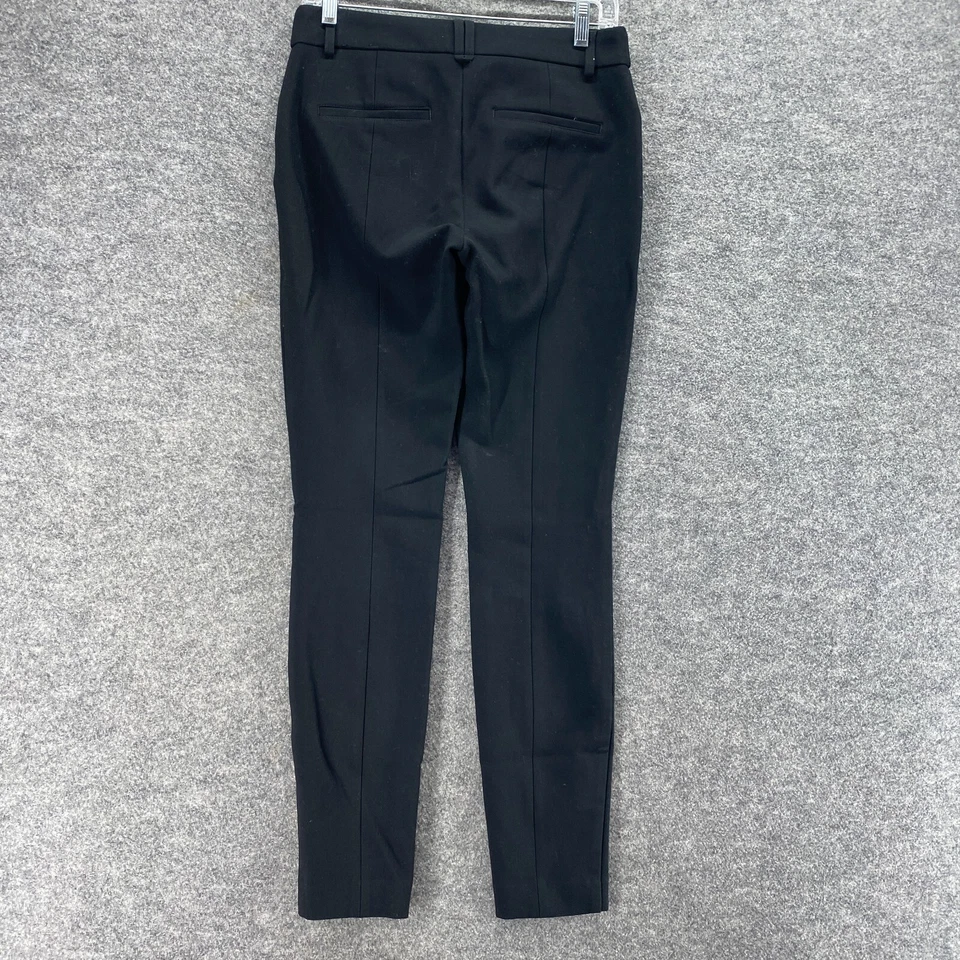 Pantalones Express para mujer 4 negros ajustados tiro medio bolsillos delanteros planos rayón informales Foto 2 de 4