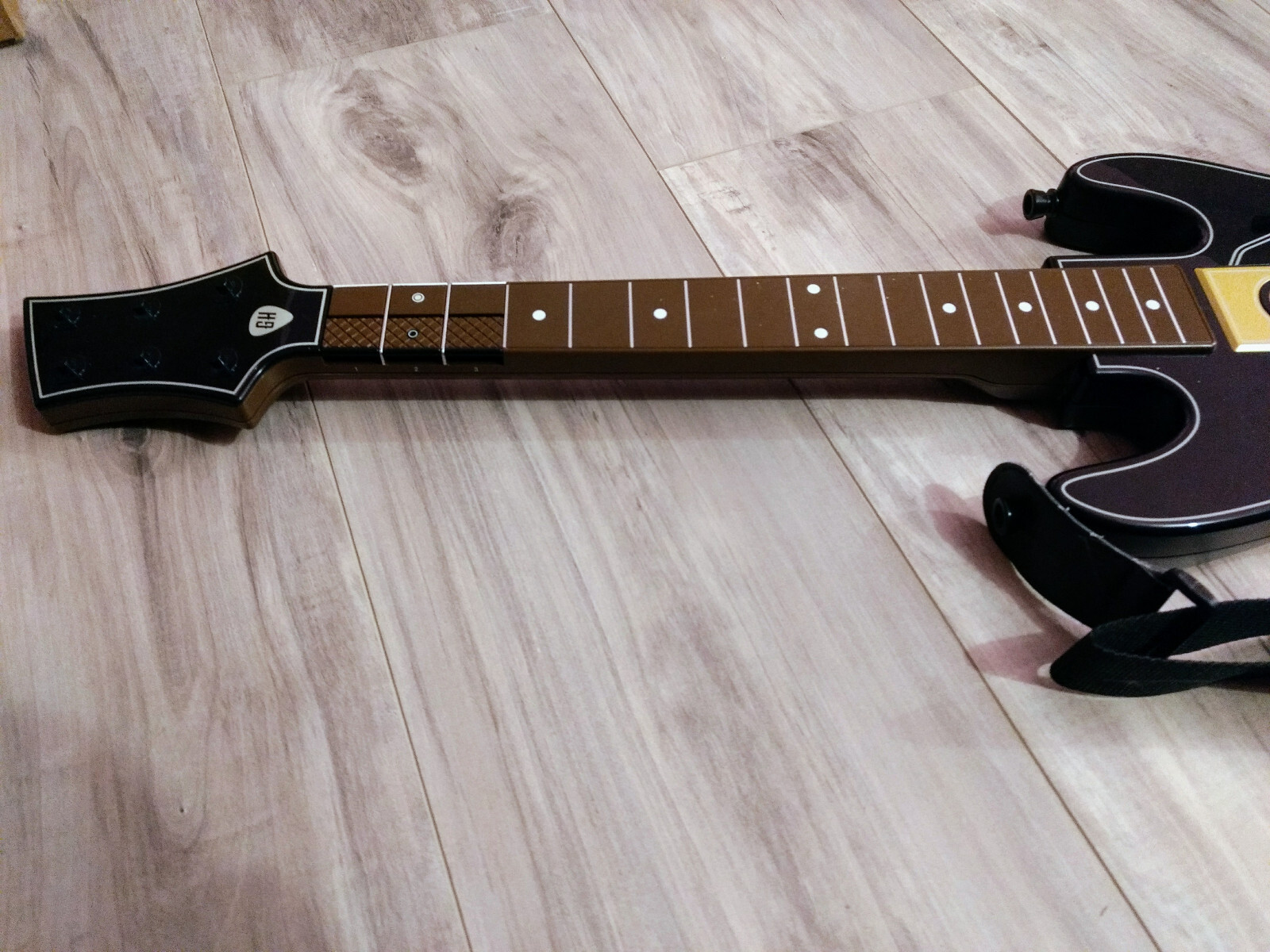 Used black Guitar Hero controller Hero Power Guitar Model 0000654. No