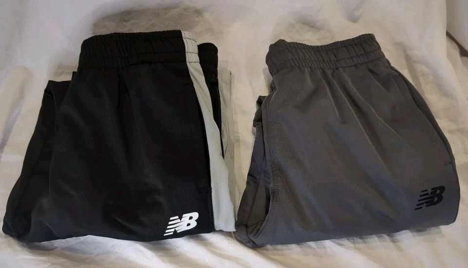 2 Pantalones de chándal New Balance talla 10/12 unisex niños niños niñas negros y grises Foto 2 de 4