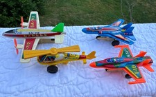 4 Tin Friction Toy Airplanes/NavyF-18  F-14. H-5 Helicopter, SA-712 Passenger
