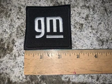 Embroidered Black GM Iron On and/or Sew On Patch