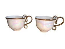 grace’s teaware irridescent teacup with gold swirl handle 