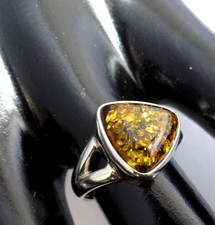 Lovely solid sterling silver ring set with  green amber size M