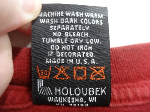 Black vintage Fletcher’s Harley-Davidson Clearwater, FL T-shirt men XL with orange “Made in U.S.A.” text and washing instructions.