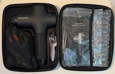 Dacorm handheld percussion massage gun with accessories and carrying case.
