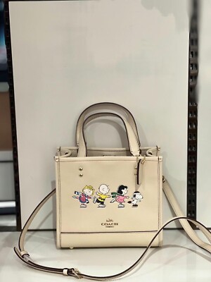 NWT CE850 Coach X Peanuts Dempsey Tote 22 with Snoopy and Friends Motif