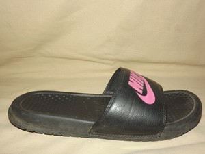 pink and black nike slides