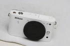 Nikon 1 J1 10.1MP Mirrorless Digital Camera Body white with orginal charger