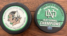 Lot of 2 University North Dakota UND Fighting Sioux Hockey Puck NHL Banned Logo