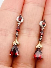 Zales natural garnet diamond earrings setting in sterling silver and 14k