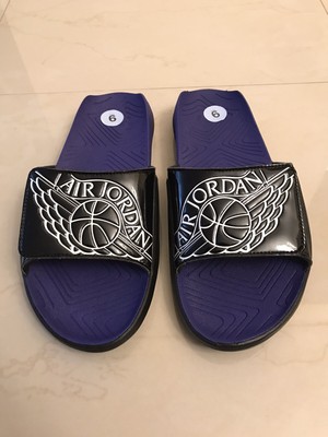 black and purple nike slides